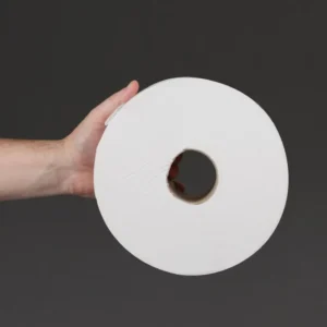Rouleau de papier toilette Jumbo Jantex tenu en main